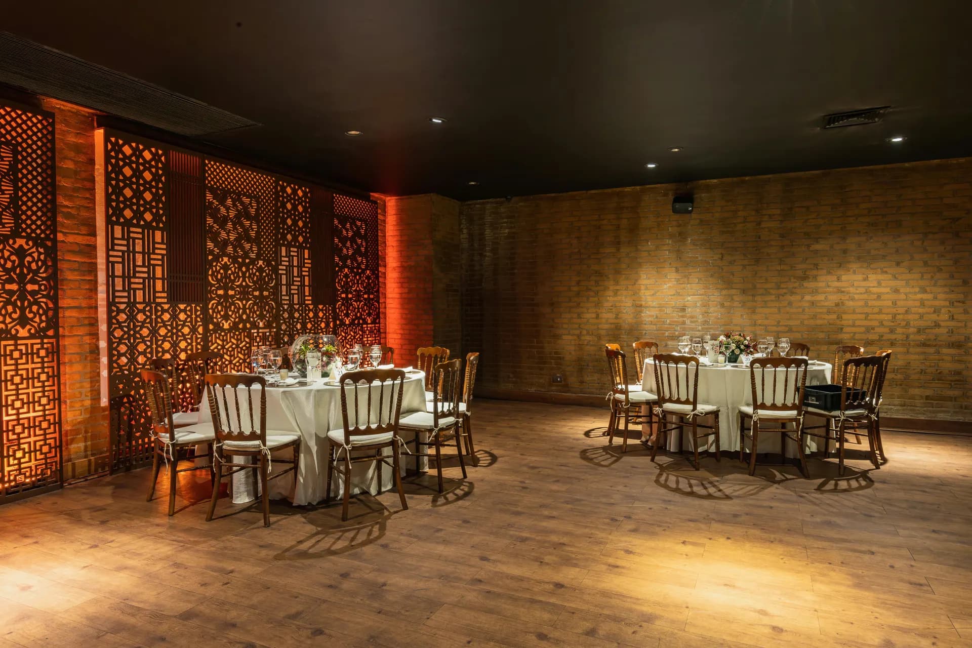 Private Parties - decorated tables in restaurant amber wood aesthetic no people