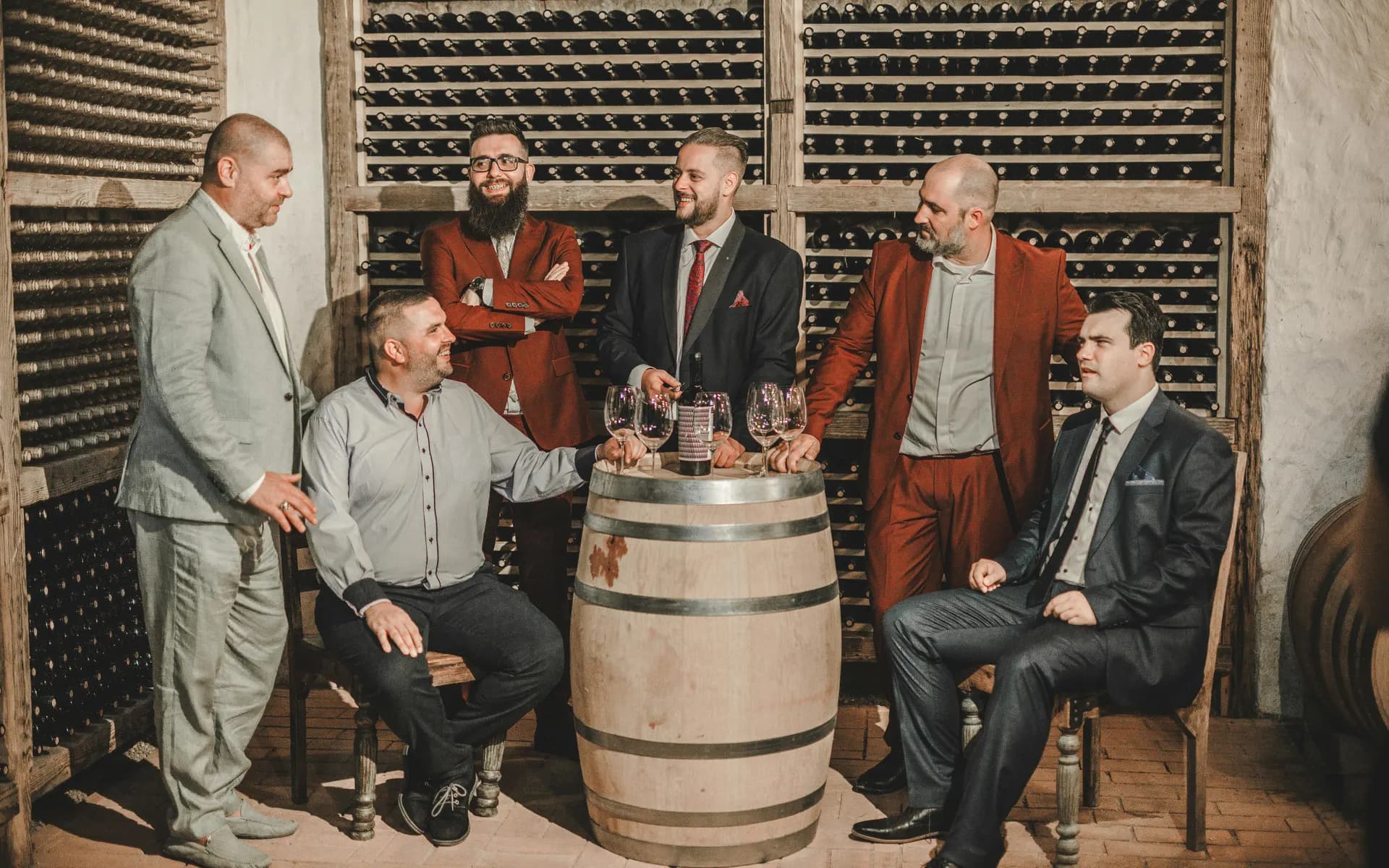 Private Parties - men in suits and shirts sitting at winery