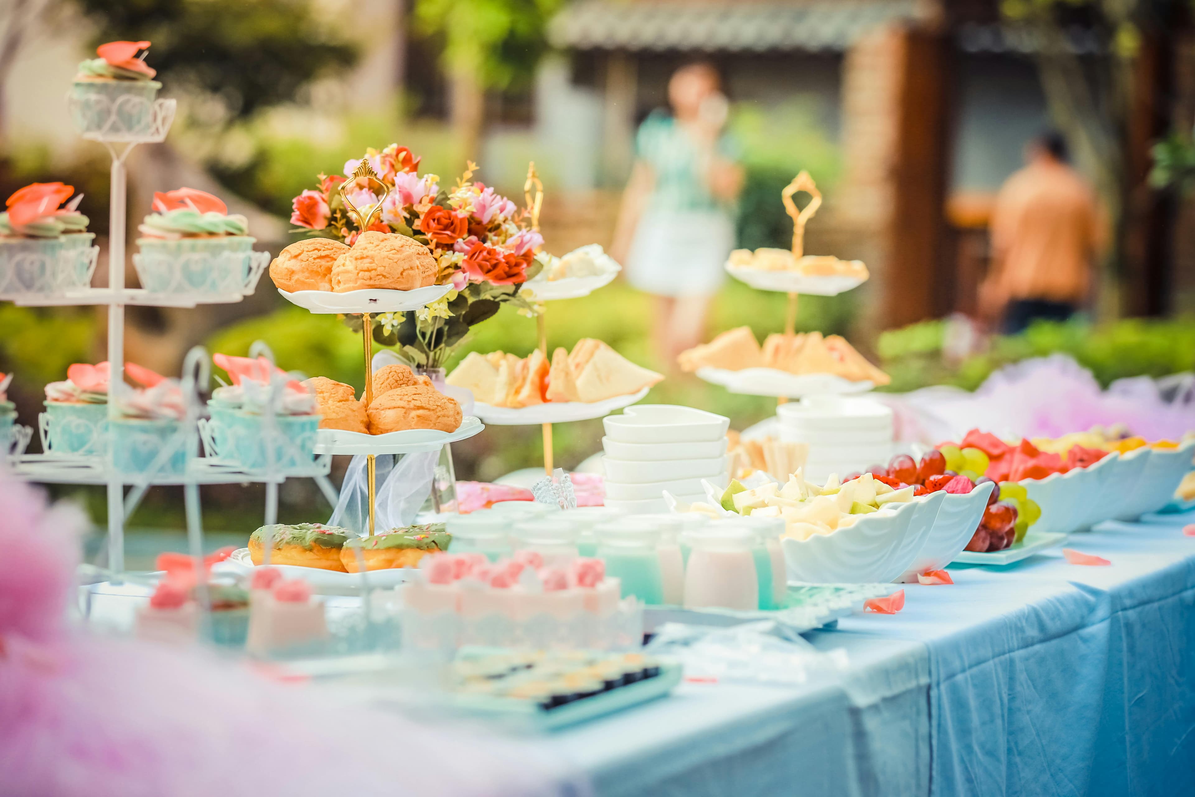 Private Parties - various desserts on a table covered with baby blue cover