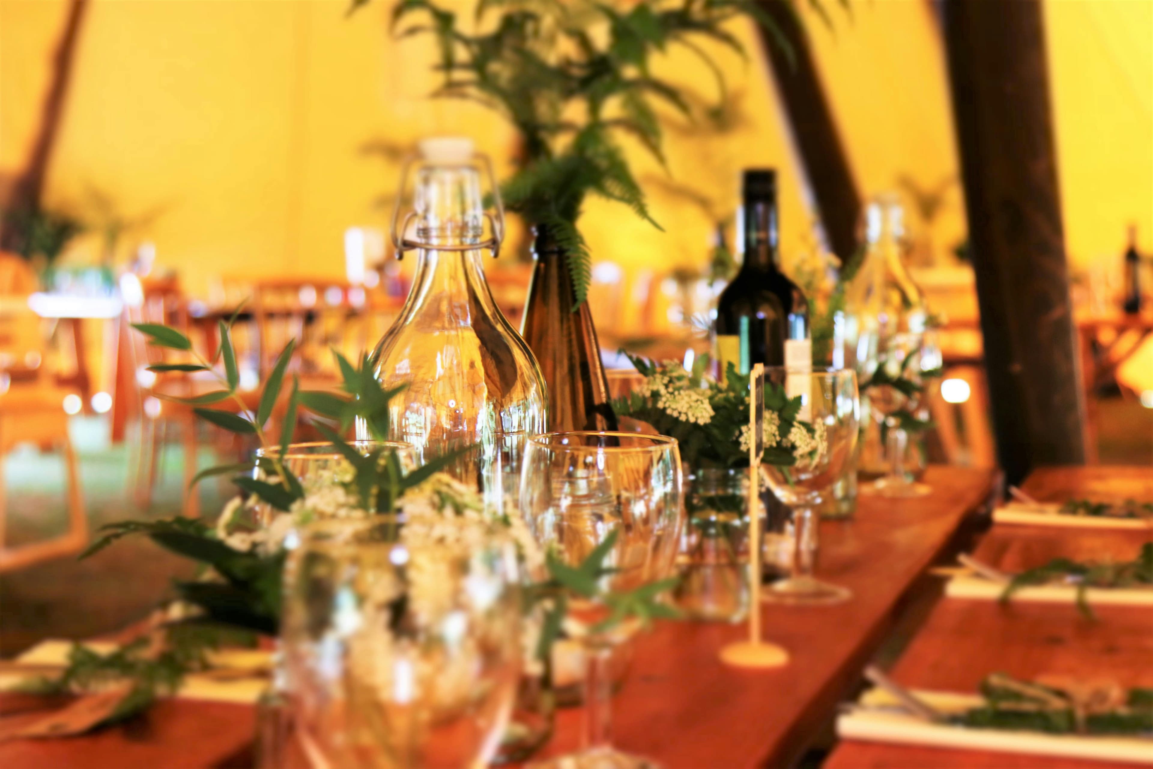 Private Parties - wine glasses and wine bottles on top of brown wooden table